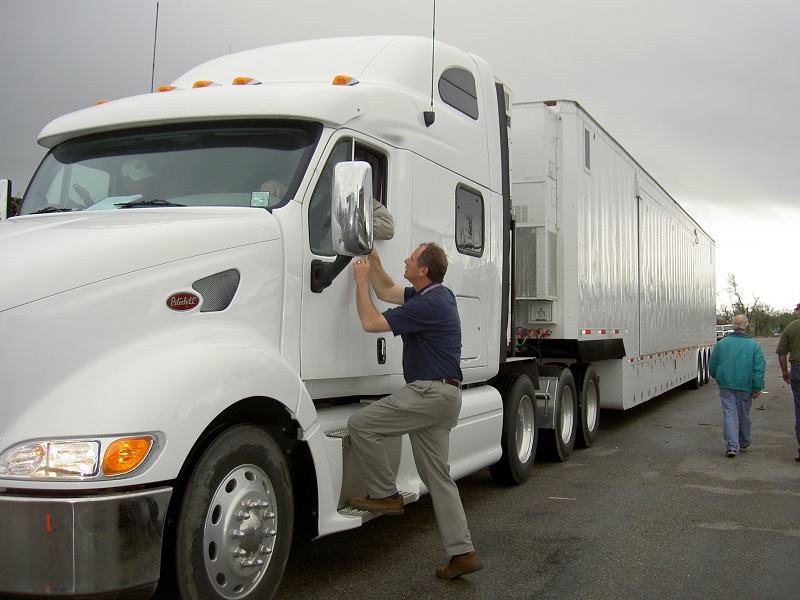 FEMA's Richard Hainje talks to a truck driver in Kansas